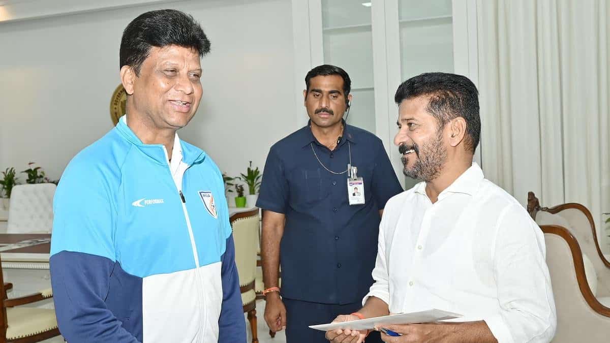G. Palguna, the secretary of the Telangana Football Association, with Telangana Chief Minister Revanth Reddy in Hyderabad, Image Credits- Sportstar
